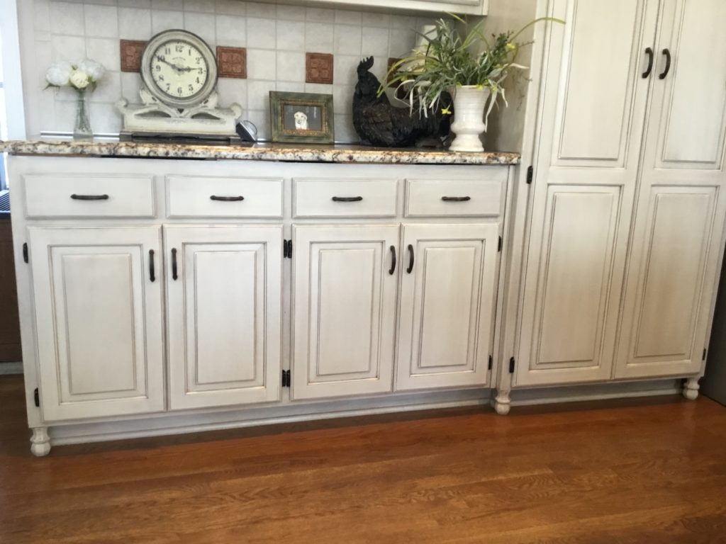 add furniture bun feet to kitchen cabinets